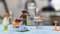 Toy figures representing a physical rehab lab.